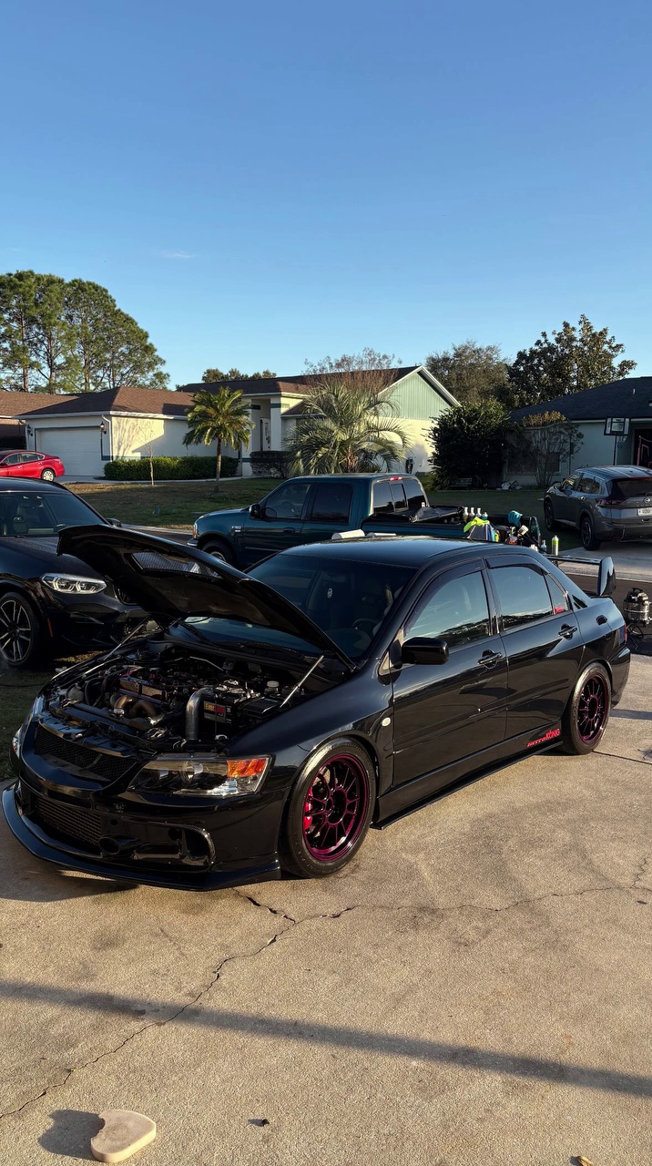 Black Sedan Hood Popped
